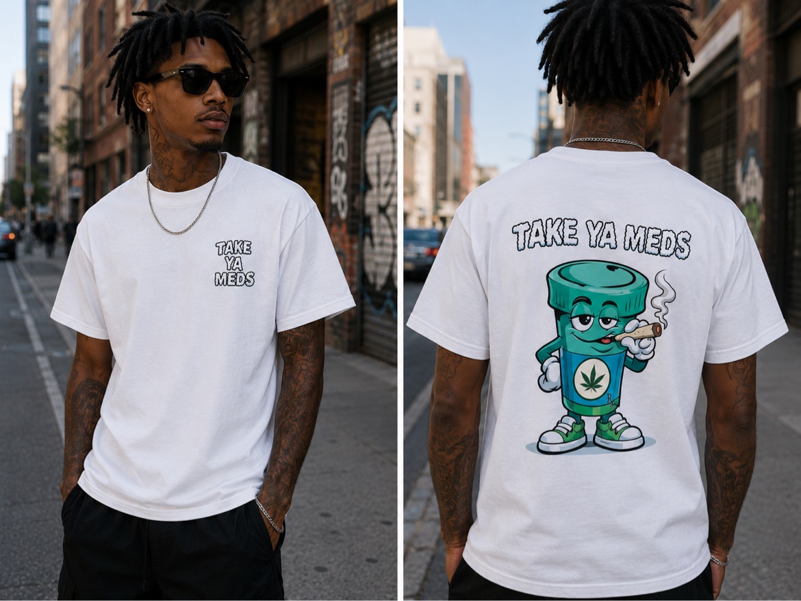 Model wearing the white Mascot Tee on a city street — TAKE YA MEDS chest logo in front, big teal mascot graphic across the back